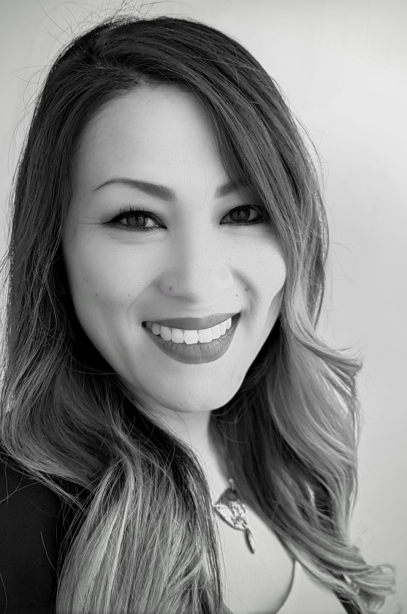 Black and white photo of Diana Thao, an AVLancer employee. 